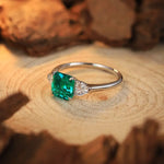 Load image into Gallery viewer, Emerald and diamond ring with a silver band.
