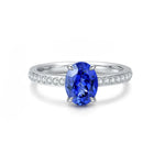 Load image into Gallery viewer, Sapphire and diamond engagement ring with an oval-cut center stone.
