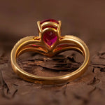 Load image into Gallery viewer, Gold ring with a pear-shaped ruby gemstone.
