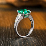 Load image into Gallery viewer, 3.5 Ct Cushion Shape Lab Emerald Four Prongs Graduating Pave Engagement Ring
