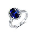 Load image into Gallery viewer, Sapphire and diamond ring with an oval-cut center stone set in white gold or platinum.
