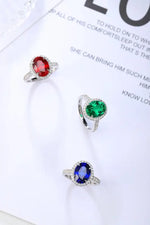 Load image into Gallery viewer, Three gemstone rings featuring red, green, and blue stones set in silver-colored bands.
