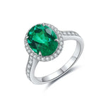 Load image into Gallery viewer, Emerald and diamond ring with a silver band.
