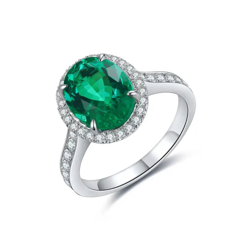 Emerald and diamond ring with a silver band.