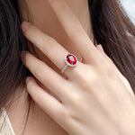 Load image into Gallery viewer, Ruby ring with a diamond-encrusted band.
