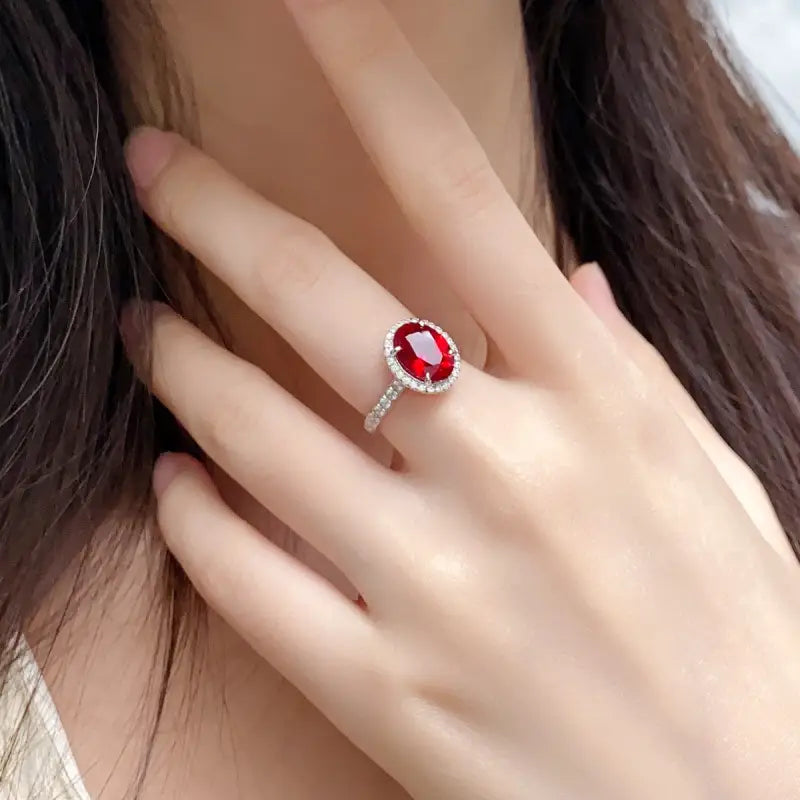 Ruby ring with a diamond-encrusted band.