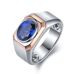 Load image into Gallery viewer, Silver and rose gold ring featuring an oval blue gemstone.
