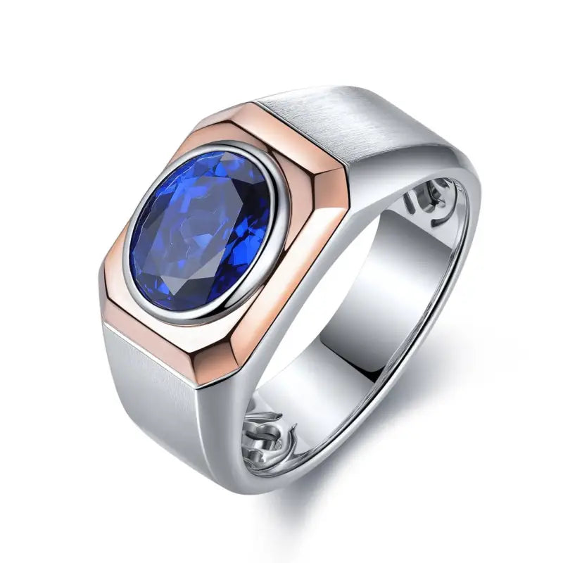 Silver and rose gold ring featuring an oval blue gemstone.