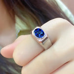 Load image into Gallery viewer, Silver ring with a vibrant blue gemstone in a square setting.
