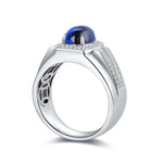 Load image into Gallery viewer, Silver ring with a prominent blue cabochon gemstone and diamond accents.
