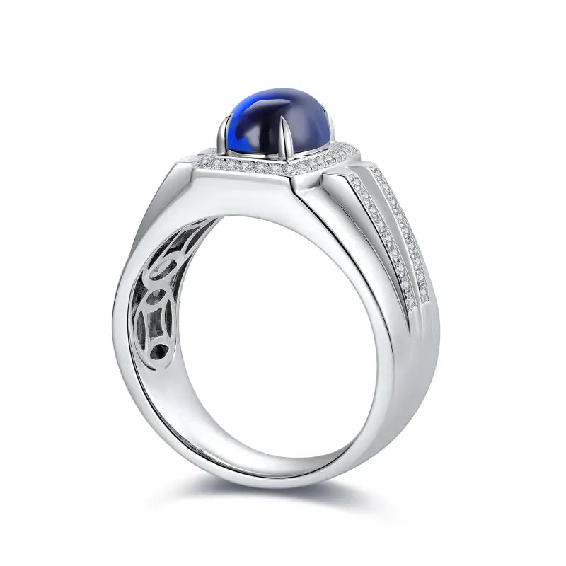 Silver ring with a prominent blue cabochon gemstone and diamond accents.