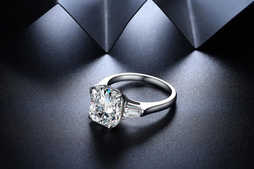 Diamond engagement ring with a prominent center stone and side accents.