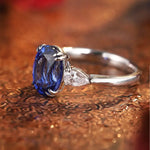 Load image into Gallery viewer, Sapphire and diamond ring with a silver band.
