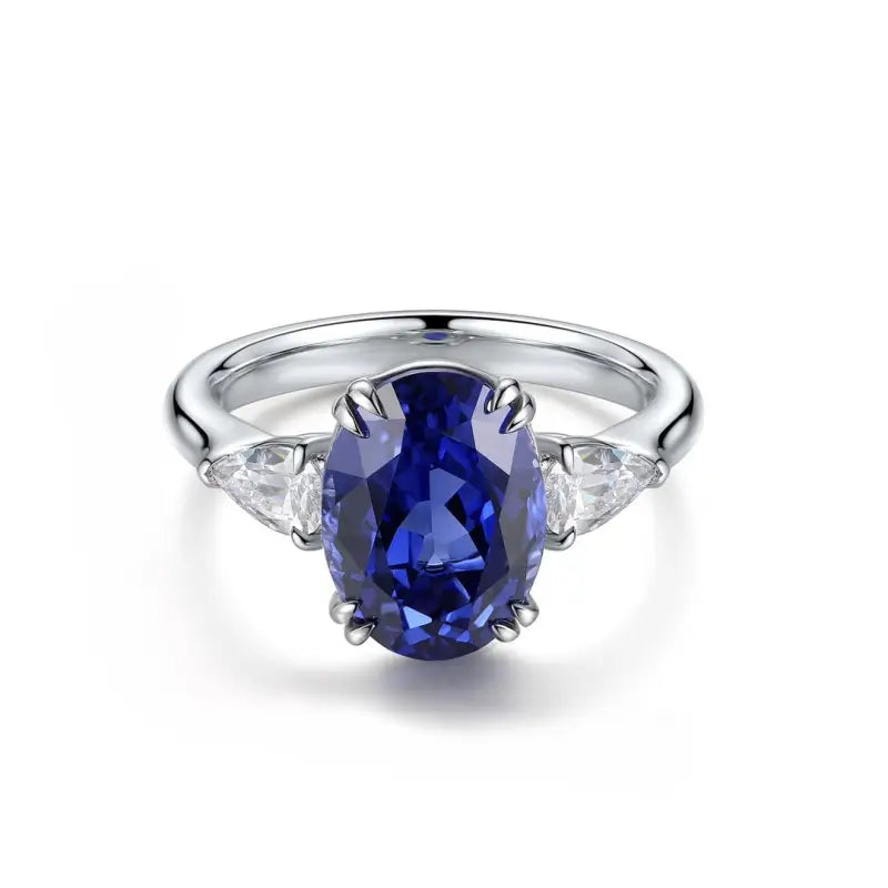 Sapphire and diamond engagement ring with a silver band.