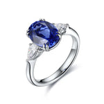 Load image into Gallery viewer, Sapphire and diamond engagement ring with a silver band.
