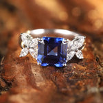 Load image into Gallery viewer, Sapphire and diamond engagement ring with butterfly-shaped side stones.
