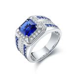 Load image into Gallery viewer, Ornate silver ring featuring a square-cut blue gemstone surrounded by smaller blue and white stones.
