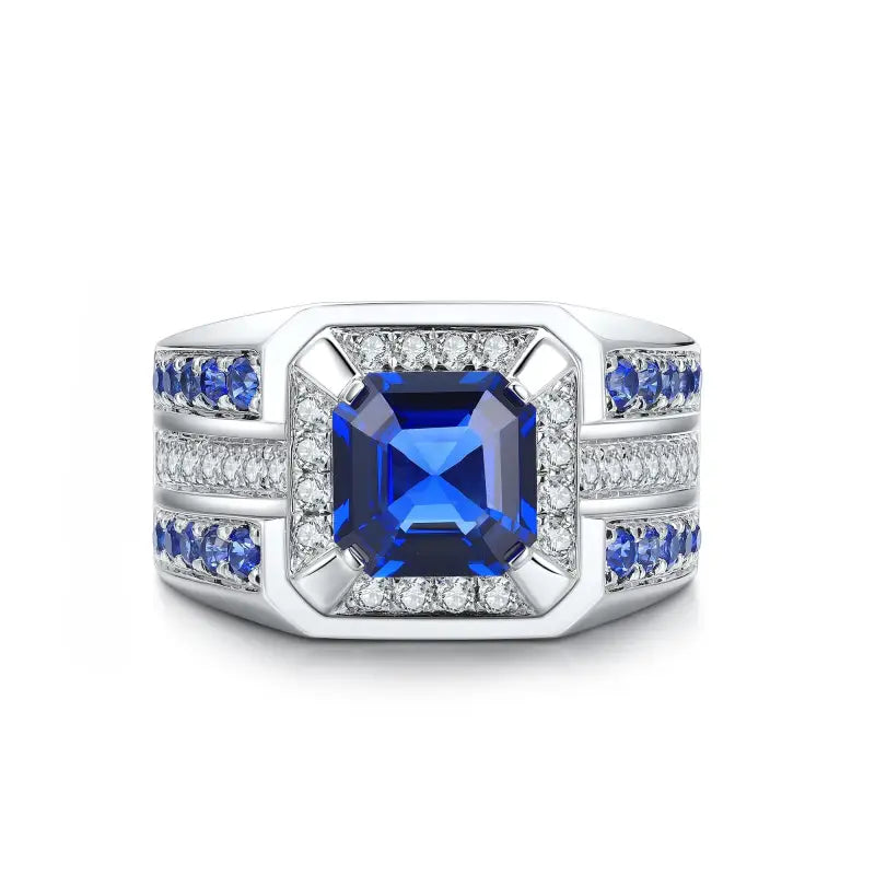 Ornate silver ring featuring a square-cut blue sapphire center stone surrounded by diamonds and smaller sapphires.