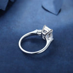 Load image into Gallery viewer, Diamond engagement ring with a solitaire setting on a silver band.
