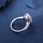 Load image into Gallery viewer, Silver ring with a pink gemstone in an ornate setting.
