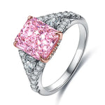 Load image into Gallery viewer, Ornate silver ring featuring a prominent square-cut pink diamond centerpiece.
