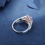 Load image into Gallery viewer, Engagement ring with a pink center stone and diamond accents on a silver band.
