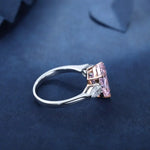 Load image into Gallery viewer, Silver ring with a rectangular pink gemstone.
