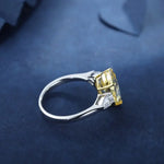 Load image into Gallery viewer, Silver ring with a yellow gemstone and smaller clear gemstones.
