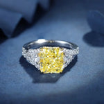 Load image into Gallery viewer, Dazzling yellow diamond engagement ring with white diamond accents.
