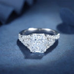 Load image into Gallery viewer, Sparkling diamond engagement ring with a prominent square-cut center stone.
