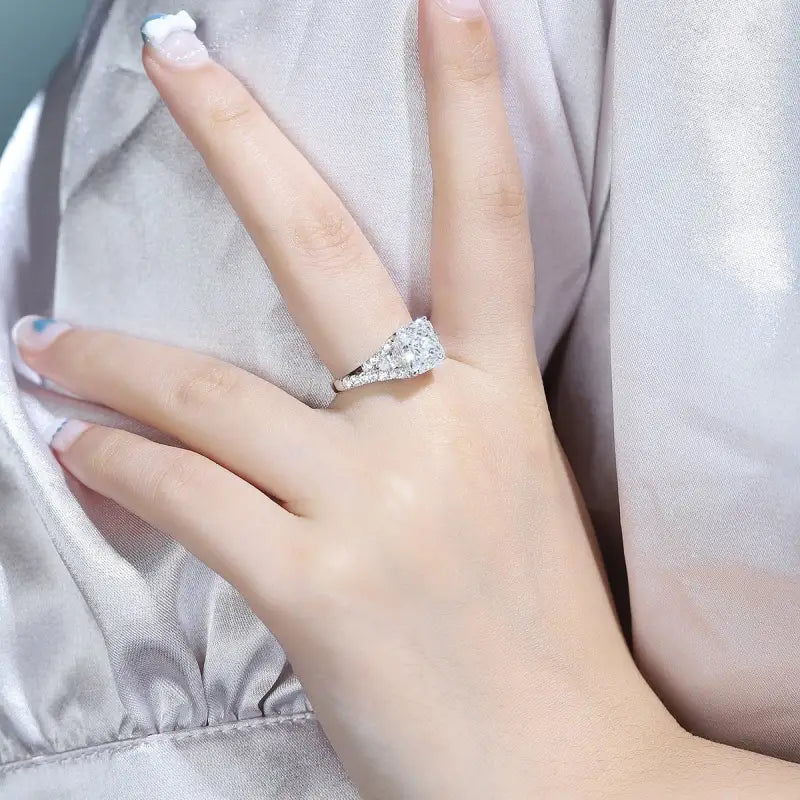 Diamond engagement ring on a woman’s hand.