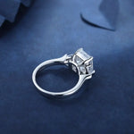 Load image into Gallery viewer, Diamond engagement ring with a square-cut center stone in a white gold or platinum setting.
