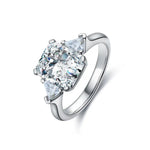 Load image into Gallery viewer, Diamond engagement ring with a pear-shaped center stone and silver band.
