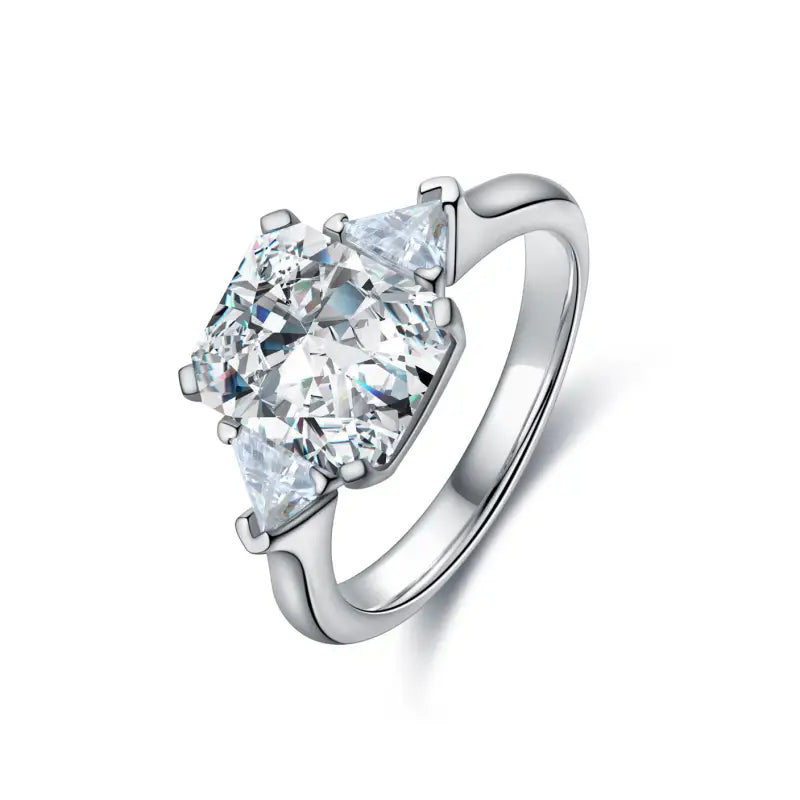 Diamond engagement ring with a pear-shaped center stone and silver band.