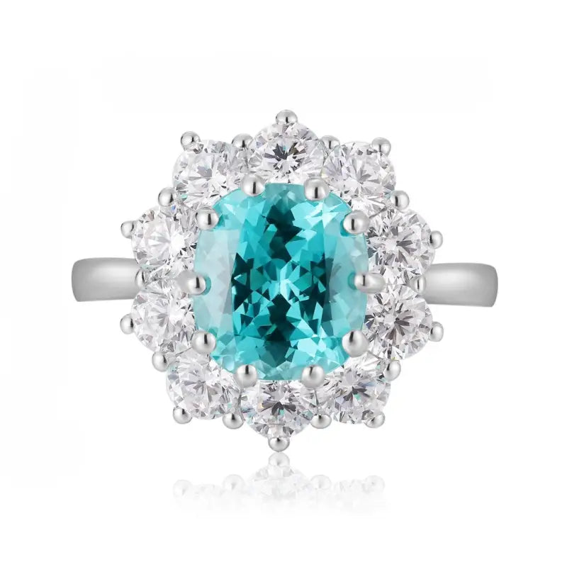 Elegant ring featuring a vibrant blue-green gemstone surrounded by sparkling diamonds.