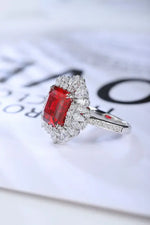 Load image into Gallery viewer, Elegant ring featuring a rectangular red gemstone surrounded by small diamonds.
