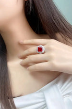 Load image into Gallery viewer, Ornate ring featuring a square-cut red gemstone surrounded by smaller clear stones.
