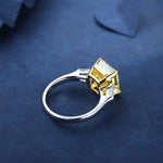 Load image into Gallery viewer, Silver ring with a square yellow gemstone in a cube-shaped setting.
