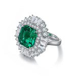 Load image into Gallery viewer, Ornate emerald and diamond ring with a silver band.
