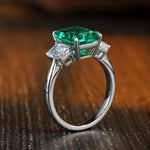 Load image into Gallery viewer, Emerald and diamond ring with a silver band.
