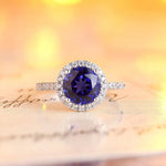 Load image into Gallery viewer, Elegant ring featuring a round deep purple gemstone surrounded by small diamonds.
