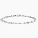 Load image into Gallery viewer, Delicate diamond tennis bracelet with oval-cut stones set in a silver or white gold chain.
