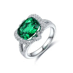 Load image into Gallery viewer, Emerald and diamond ring with a silver band.
