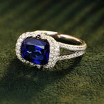 Load image into Gallery viewer, Sapphire and diamond ring with a cushion-cut center stone.
