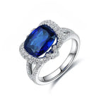 Load image into Gallery viewer, Sapphire and diamond ring with a silver band.
