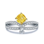 Load image into Gallery viewer, Elegant diamond ring featuring a yellow cushion-cut center stone and split shank design.
