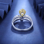 Load image into Gallery viewer, Diamond engagement ring with a gold prong setting on a silver band.
