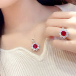 Load image into Gallery viewer, Ruby and diamond jewelry set featuring a ring and matching pendant.
