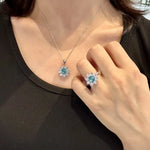 Load image into Gallery viewer, Matching set of aqua blue gemstone jewelry featuring a necklace pendant and ring.
