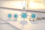 Load image into Gallery viewer, Jewelry set featuring aquamarine and diamond snowflake-shaped pieces.
